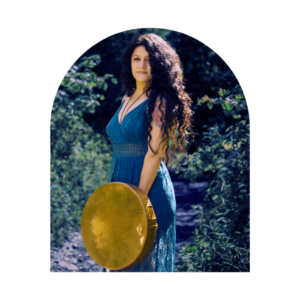 spiritual woman standing in a river with a shamanic drum