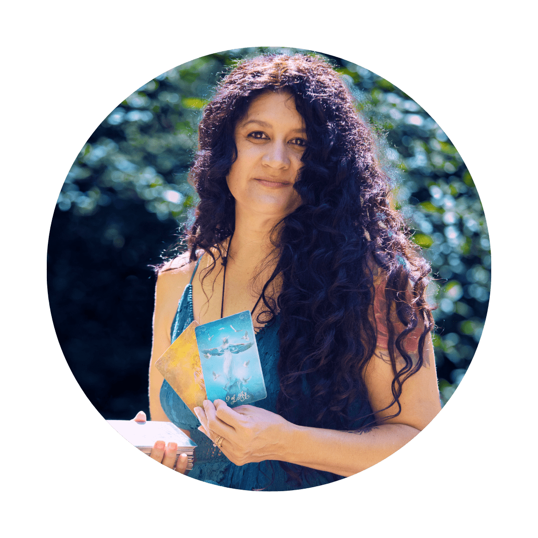 spiritual woman holding a tarot deck