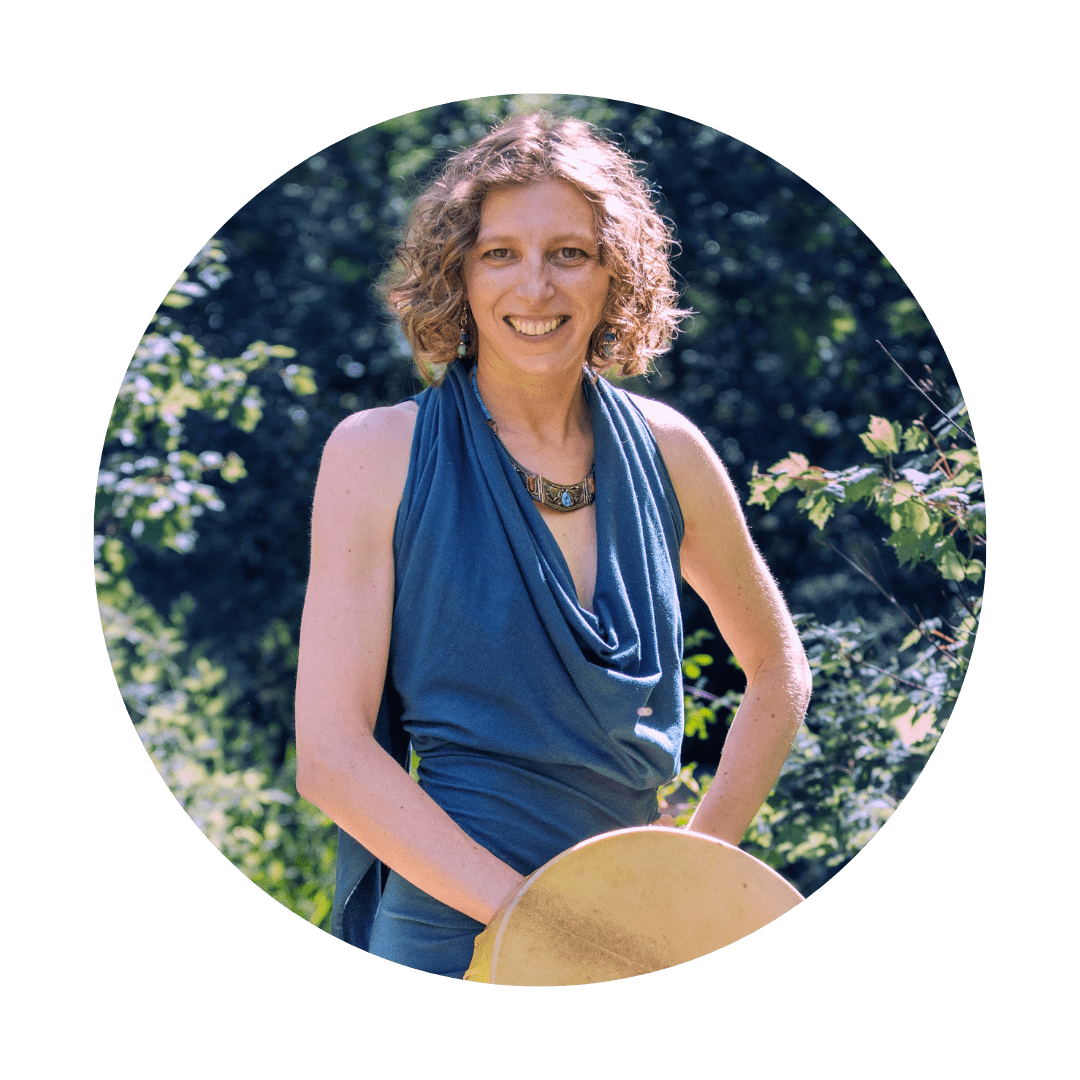 spiritual woman posing with a shamanic drum