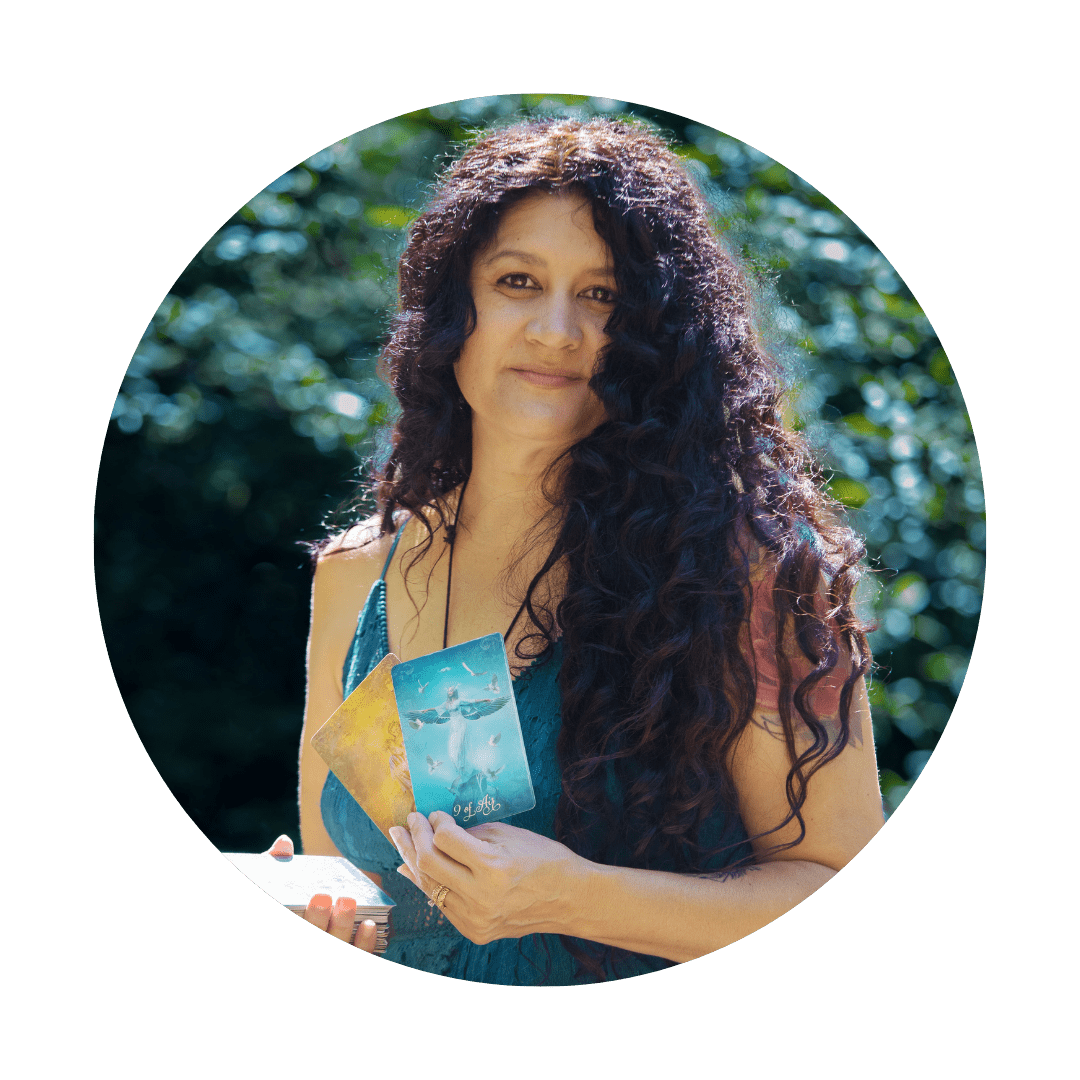 spiritual woman holding a tarot card