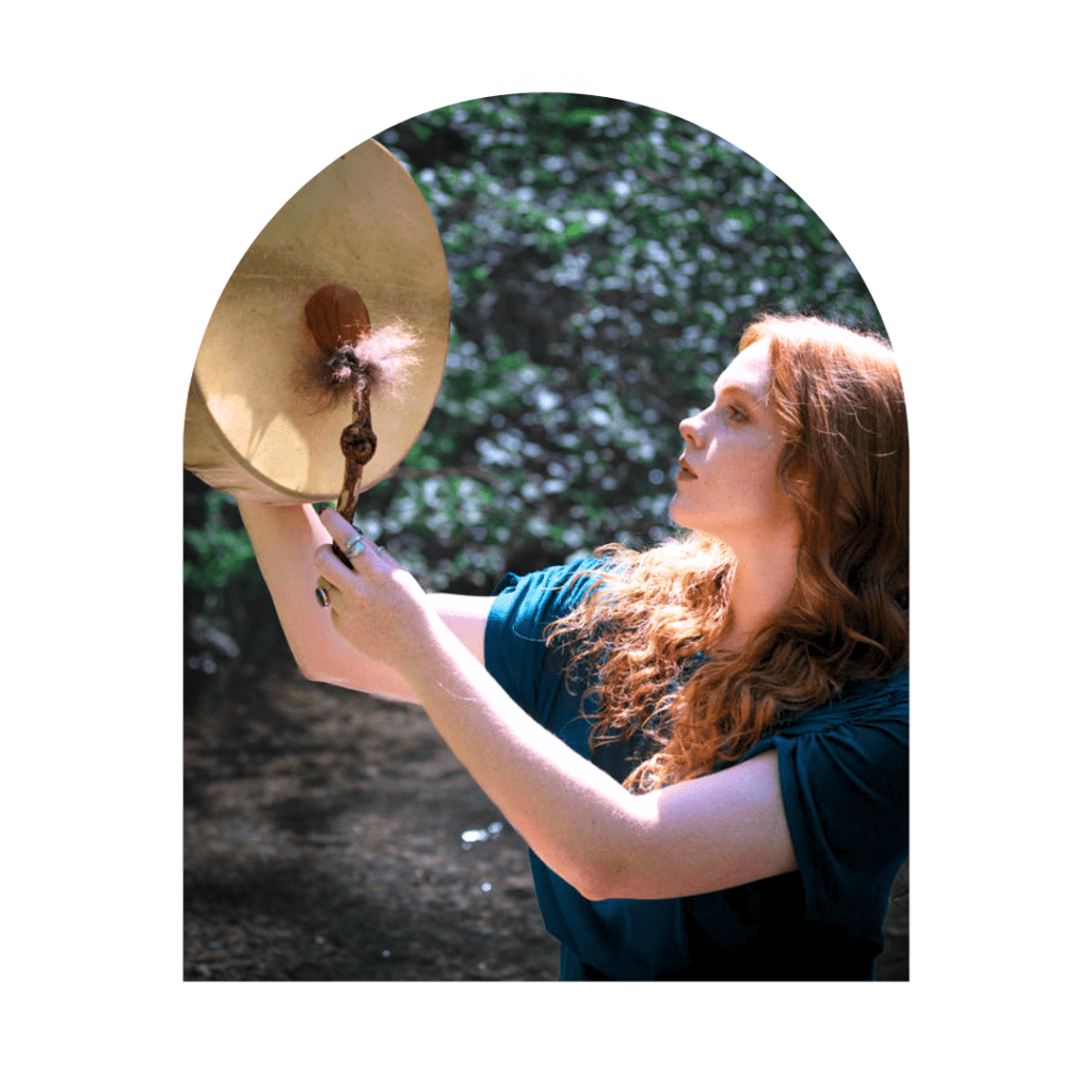 spiritual woman holding a shamanic drum