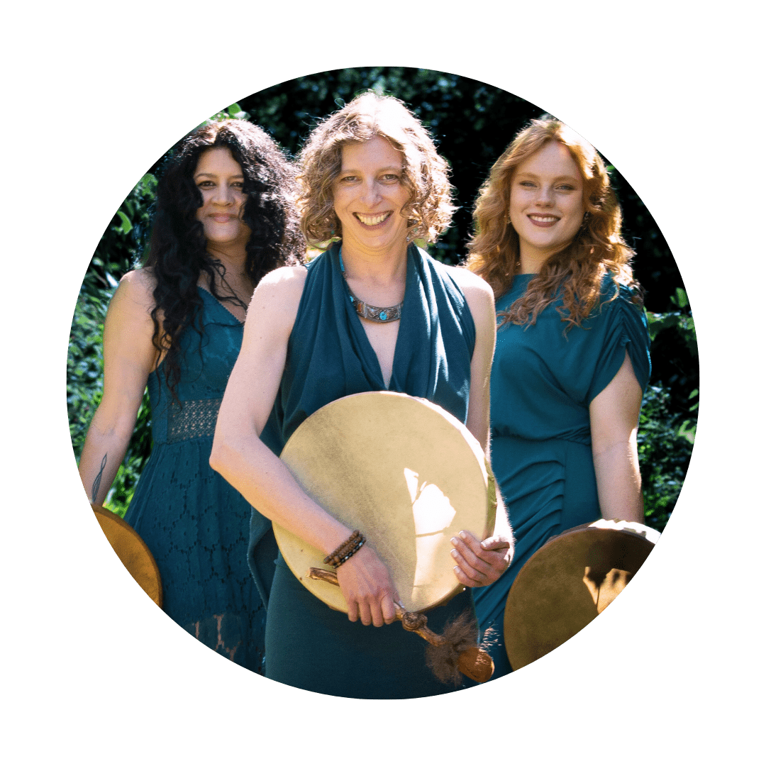 three spiritual women holding shamanic healing drums