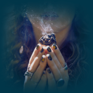 spiritual woman holding a shamanic sage bundle