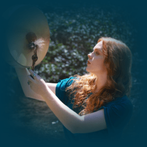 woman beating a shamanic drum for a shamanic journey