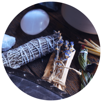 sage and palo santo with crystals for energy protection